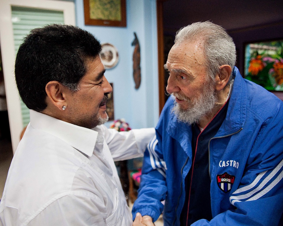 In this picture image released by Cuba's state newspaper Granma on Monday April 15, 2013, Cuba's Fidel Castro shakes hands with former soccer star Diego Maradona in Havana, Cuba, Saturday April 13, 2013. . (AP Photo/Alex Castro, Granma)